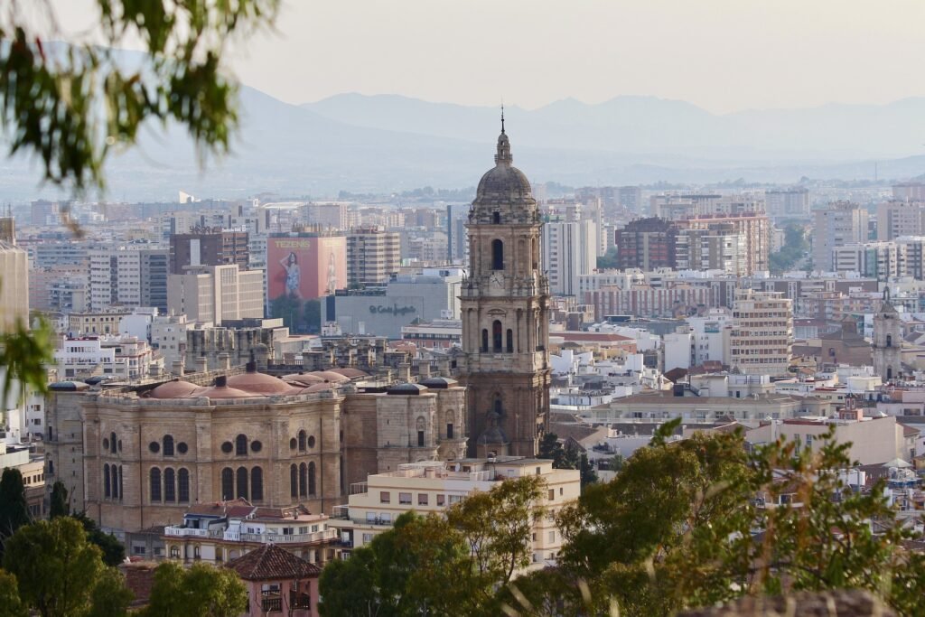 Areal view of Málaga city with mountains in background. It's one of the best things to do in Costa del Sol.