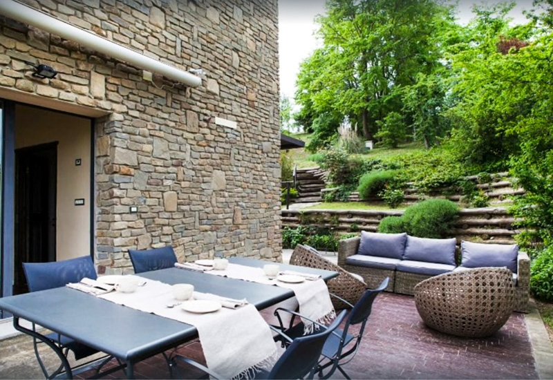 Outdoor dining at this peaceful villa in Italy nestled in the hills of Bologna.