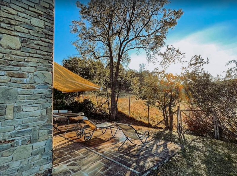 Outdoor seating to relax and take in the gorgeous views that surround this Italian villa nestled in the hills of Bologna.