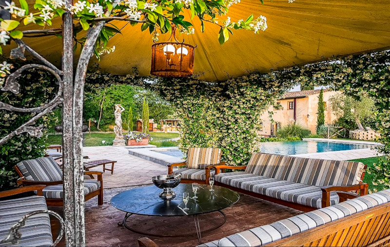 Hang out near the outdoor pool at this villa in Italy for rent.