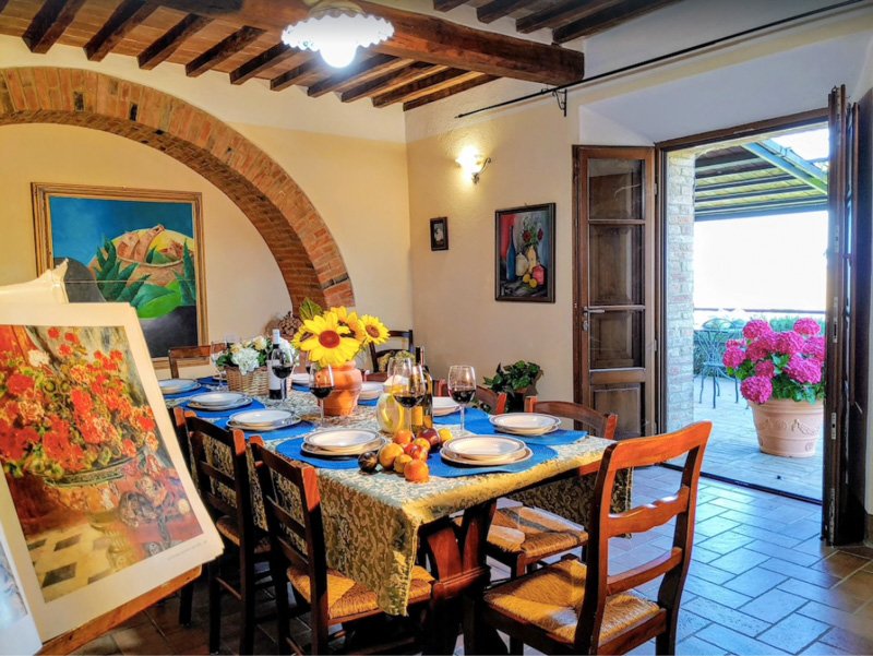 Charming dining room of an Italian villa for rent in Tuscany.