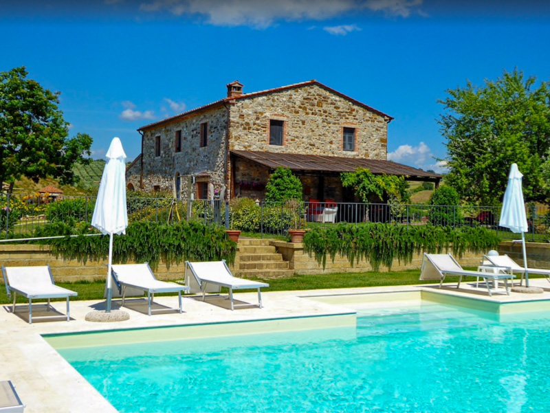 Stone villa in Italy for rent with private pool and plenty of space to bask in the sun.